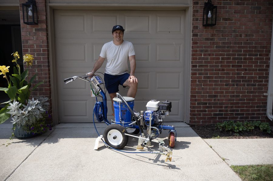 True Line Pavement owner with his Graco LineLazer striping machine, Shelby Township, Michigan