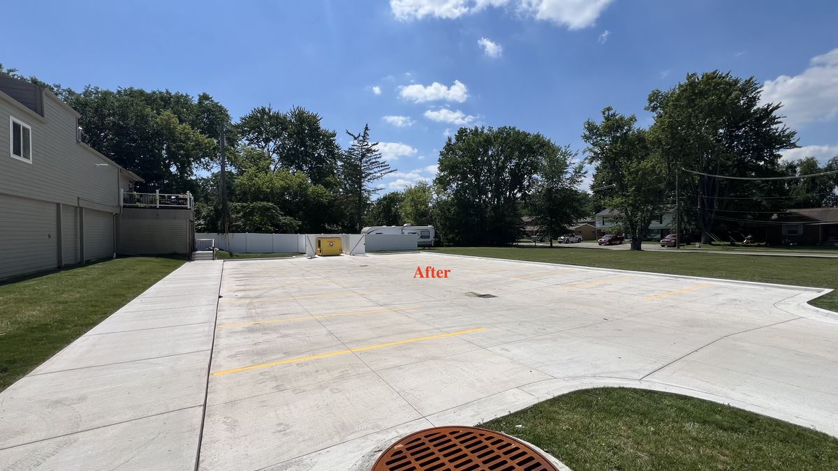 Freshly striped parking lot with crisp yellow lines by True Line Pavement in Macomb County, Michigan
